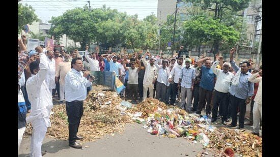 Sanitation workers protest and dump waste outside MC office in Mohali